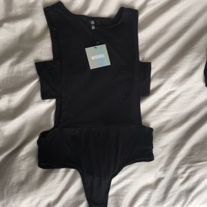Black tank top body suit with rib cut out